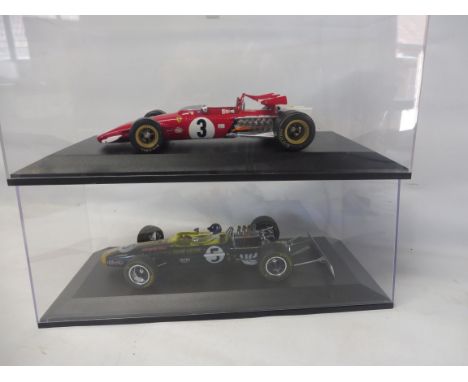 A 1:18 scale Graham Hill Team Lotus type 49 car and a Ferrari.