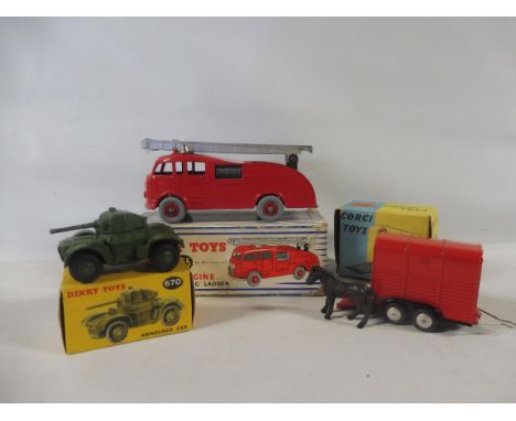 Three boxed die-cast models, a Dinky 955 fire engine, an armoured car no. 670, and a Corgi Toys Pony Trailer.