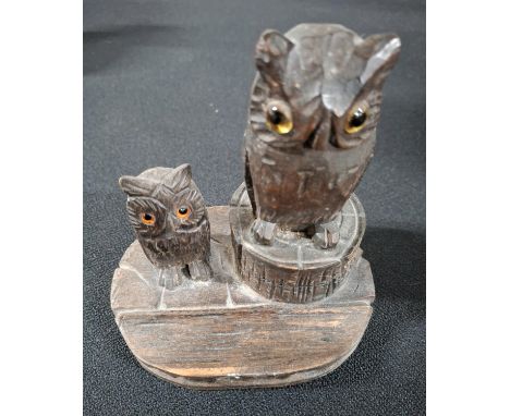 Antique Black Forest carving of two Owls the largest Owl perched on a tree stump which contains a white enamel inkwell within