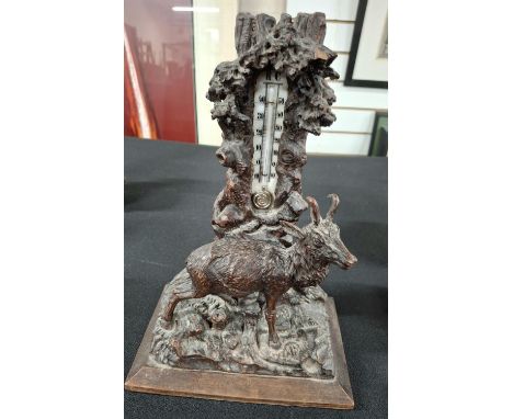 Antique Black Forest carving of a Deer before an old tree stump which incorporates a barometer,28cm tall X 19 cm wide X 11 cm
