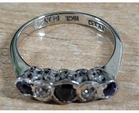 Ladies 20thC white 18ct gold and Platinum ring with round cut central Sapphire flanked by 2 round cut diamonds with a further