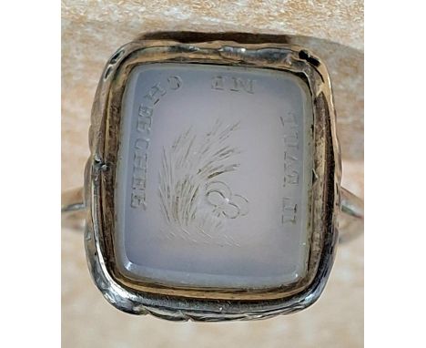 Antique (exact age unknown) carved moonstone type seal with Latin script round the outer edges, set with unmarked silver colo