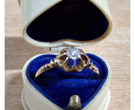 Solitaire diamond set in an unmarked, white metal ring which is sold in a pleasing old, heart shaped presentation box2.5 gram