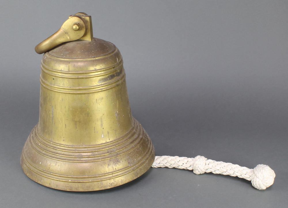 A large brass bell 13"h x 12" diam.