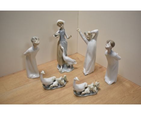 A group of Lladro porcelain figurines and ornithological groups, comprising three bedtime figures, a goose girl and two goose