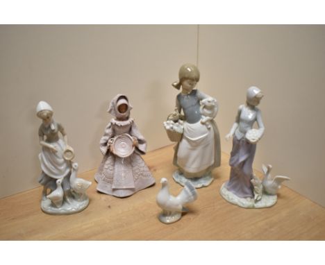 A Lladro porcelain figurine Girl with Lamb, printed and impressed marks to base, depletion to lambs ear, and sold along with 