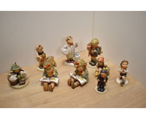 A group of nine Goebel porcelain figures and figurines, to include 'Friends' (girl and fawn) 'Little Pharmacist', 'Little Sch