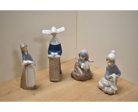 A group of four Lladro porcelain figurines, comprising shepherd boy with lamb, shepherd girl with lamb, girl with piglet and 