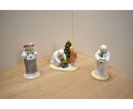 A group of three Coalport Characters 'The Snowman' figure groups, comprising Snowman's Surprise first edition, Dressing Up fi