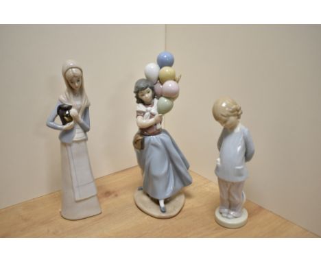Two Lladro porcelain figurines, comprising Balloon Seller and Punishment, printed marks to base of each and sold along with a