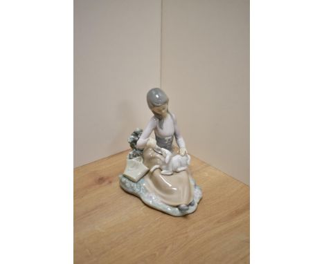 A Lladro Porcelain figurine Little Bo Peep, girl feeding lamb, printed and impressed marks to base 16.5cm