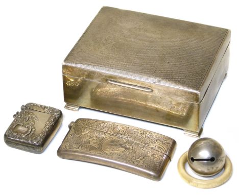 Engraved silver case by Colin Hewer, Chester, A small silver vesta case and a silver baby rattle, and an engine turned silver