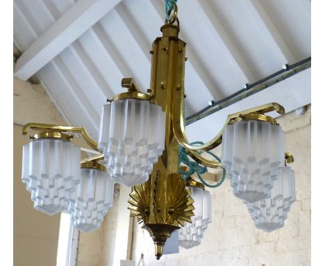 Brass Art Deco style six branch centre light fitting with six frosted glass shades and one spare. Condition reports are not a
