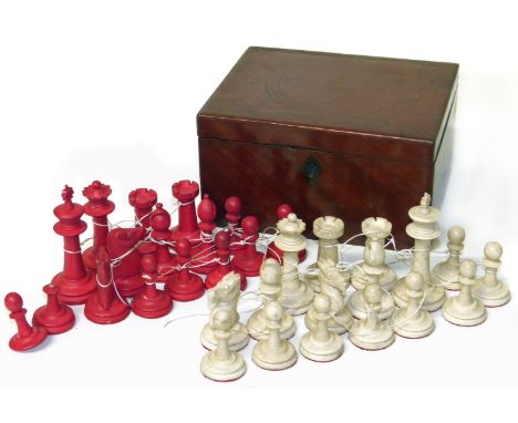 Ivory Staunton pattern chess set, natural and stained red (one pawn missing ball finial) all in mahogany box. Condition repor