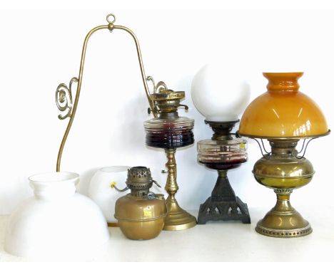 Victorian oil lamp on cast iron base, hanging oil lamp, brass rayo lamp and oil lampw ith glass bowl. Condition reports are n