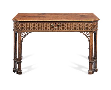 A George III mahogany writing table after a design by Thomas ChippendaleCirca 1760, of rectangular form with canted front ang