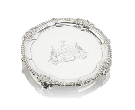 A George III silver salver from the Onslow servicePaul Storr, London 1812 Shaped-circular form, with a shell and gadroon bord