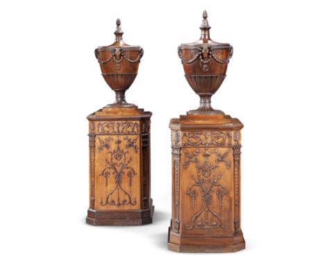 A matched pair of satinwood and carved mahogany urns and pedestalsone urn and pedestal circa 1775, the other of a later date 