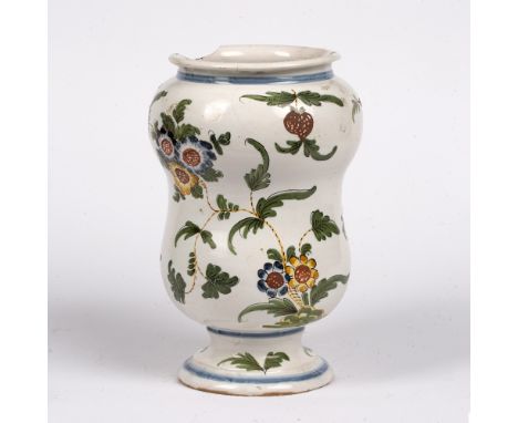 Polychrome albarello Italian, 18th Century, of baluster form painted with trailing flowers and foliage, 23cm high