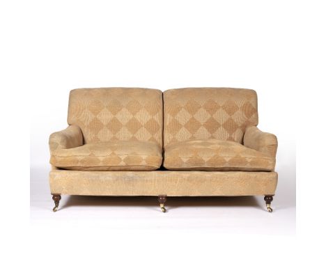 In the Manner of George Smith Two seater sofa on mahogany supports with brass castors, 185cm across, 112cm deep, 90cm high