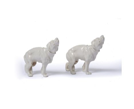 Two Royal Worcester dogs  with stamps to the legs, glazed, unpainted, 7.5cm high (2) 