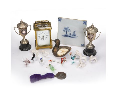 Brass cased carriage clock  French, with Roman numerals, two silver plated trophies on stands, Delft type tile, collection of