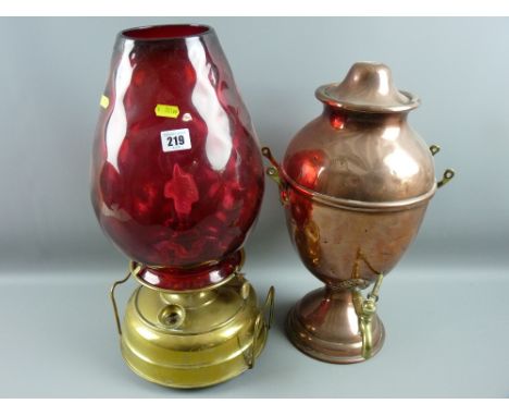 A copper and brass samovar and a large brass based oil lamp, electrically converted with a deep red glass shade