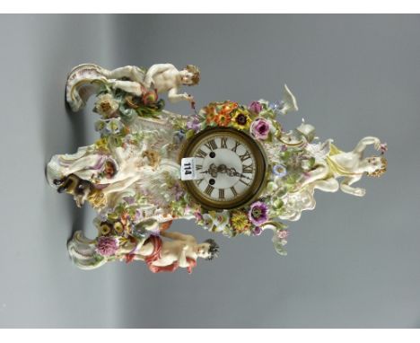 A large Meissen cherubic and floral encased mantel clock, 47 cms high, 32 cms wide
