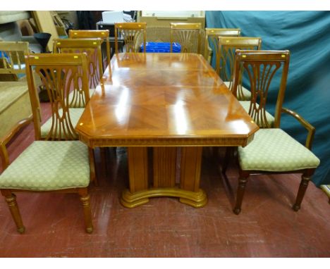 A good quality modern light oak and walnut effect extending dining table with additional leaf along with eight (six plus two)