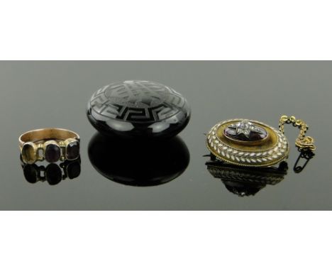 3 pieces of 19th century jewellery,
comprising a diamond garnet and enamel brooch, a Victorian jet locket and stone set gold 