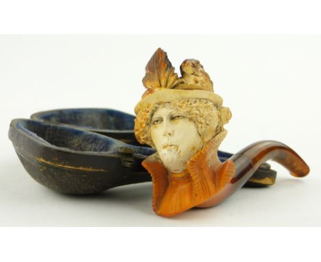 A Meerschaum pipe
with carved head of a lady wearing a hat, length 4.25", in original case.