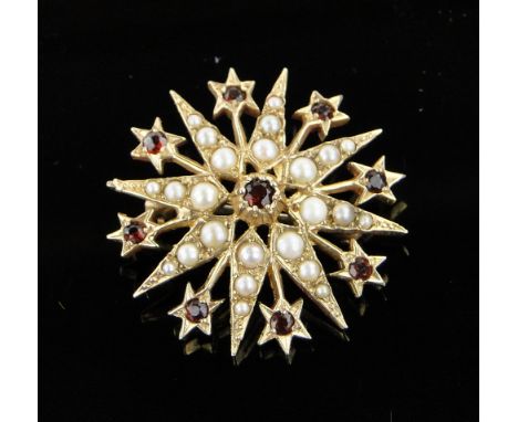 9ct gold starburst brooch,
set with garnets and pearls, 30mm across.