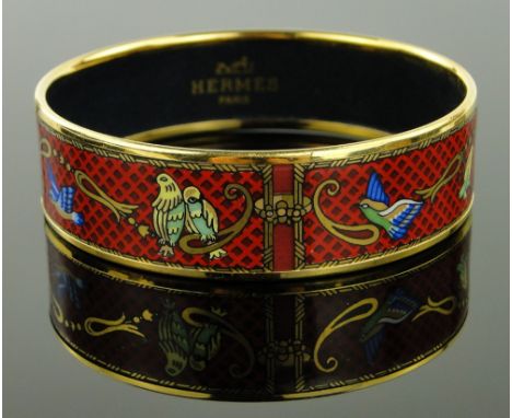 A Hermes enamel bangle
with bird designs.