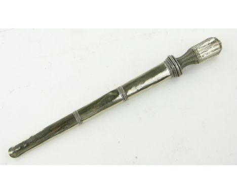 A Tibetan dagger
in white metal scabbard, 16.75".