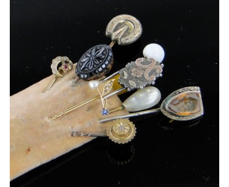 Collection of gold and other stickpins,
including one with sapphire and pearls, (9).