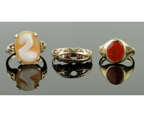 3 gold stone set rings.