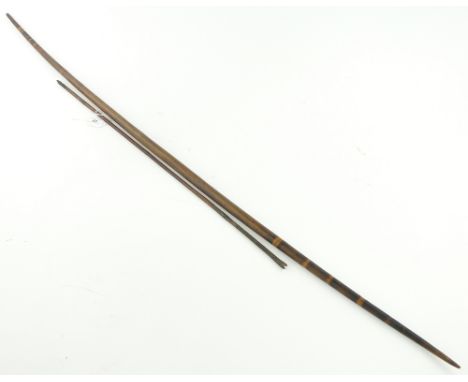 African stained wood tribal bow and arrow,
late 19th century, length 54"