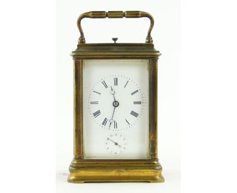 A brass cased repeater carriage clock,
with alarm, signed, height 5.25".
