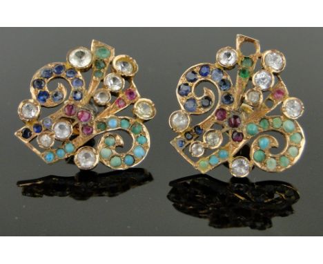 Pair of Indian multi-coloured gemstone set earrings,
unmarked gold settings, 25mm across.