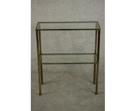 A 1970's brass console table, of rectangular form with two plate glass tiers. H.72 W.61 D.25cm. 