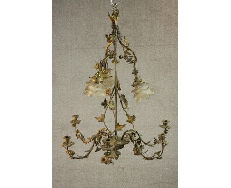 An early 20th century gilt spelter floral and foliate design chandelier, three electric floral design light fittings above a 