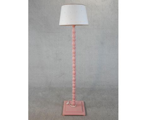 A carved and pink painted 'Elodie' standard lamp. H.180cm 