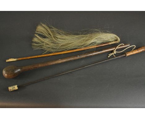 An African carved hardwood knobkerrie, along with a horse hair fly whisk and an iron blade sword stick with impressed makers 