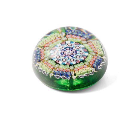 Perthshire millefiori paperweight with multicoloured design, 7cm diameter, with arrow mark to centre and underside markings. 