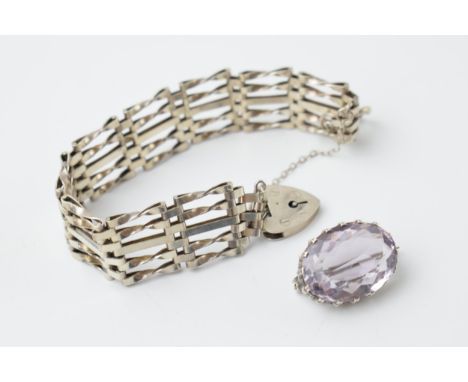 Silver gate bracelet, 18.9 grams, with a purple stone silver brooch, 5.1 grams (2).  