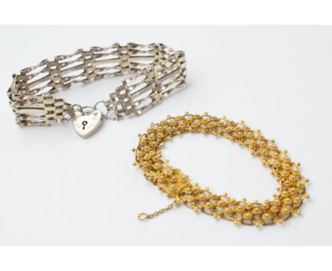 Silver gate bracelet with a continental silver gilt bracelet, 31.2 grams.  
