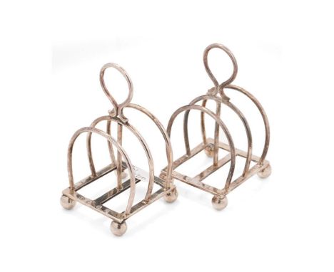A pair of hallmarked silver unusual 3 bar toast racks, Edinburgh 1912, Hamilton &amp; Inches, 100.5 grams.  