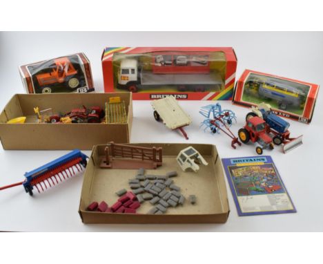 A collection of vintage Britains Toys boxed and unboxed die-cast vehicles to include, No. 9582 Flat Bed Transporter, No. 9560