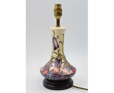 Moorcroft lamp in the Pasque pattern mounted onto wooden base, 31.5cm tall inc brass fittings.  