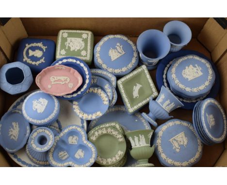 A collection of Wedgwood Jasperware pieces to include vases, lidded pots, trinket trays, dishes, pin trays and plates. In col